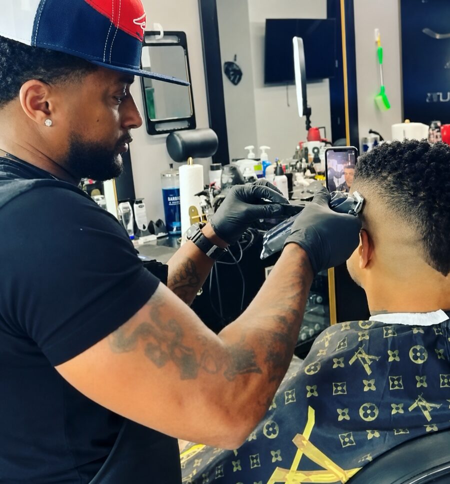 Michael Fields detailing a skin fade with clippers at The Best Cuts private barber studio in Hollywood