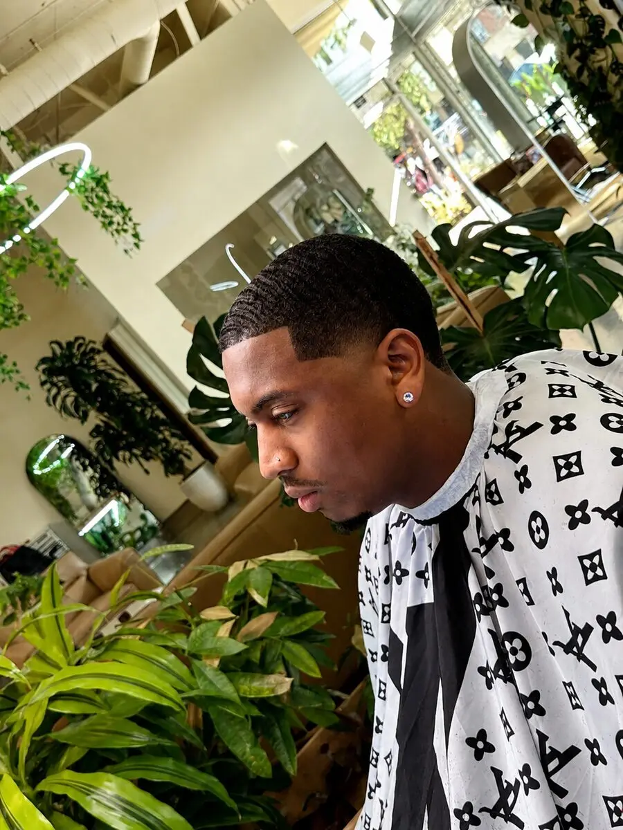 360 waves with crisp lineup and low taper fade by master barber Michael Fields at The Best Cuts, Hollywood Blvd Los Angeles