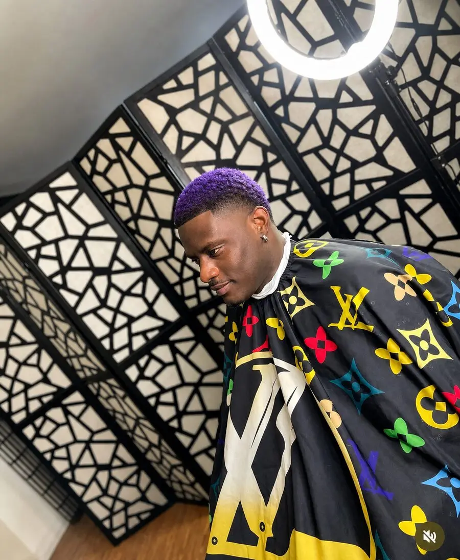 Purple hair color with precision lineup and taper fade on textured hair at The Best Cuts barbershop, Los Angeles