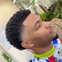 Curly taper fade with clean edges